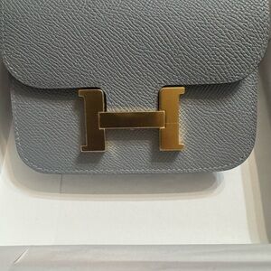 Hermes(GRIS PATINA) Constance Slim wallet/clutch/crossbody
NWT’s 
NEW IN BOX
314